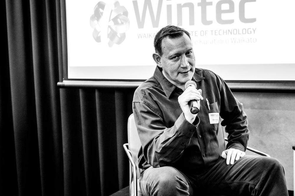Chris Hanlon speaking on a panel at a TEDxRuakura event